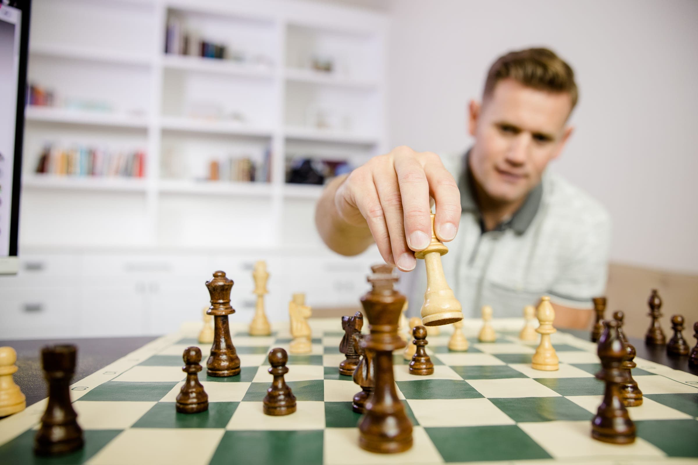 Allan Draper thinking over a chess board