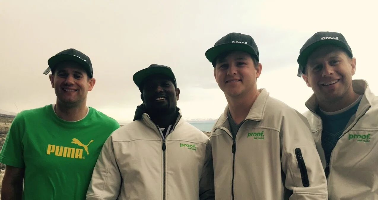 The early Proof Pest Control team in branded caps and jackets